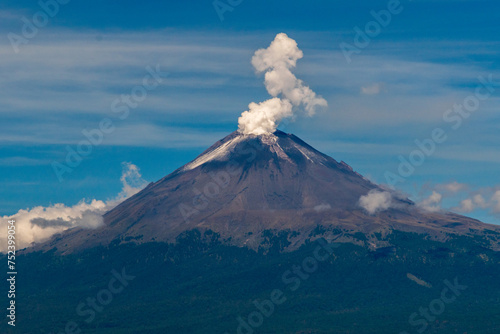 The Popocatépetl volcano with smoke coming out of it.