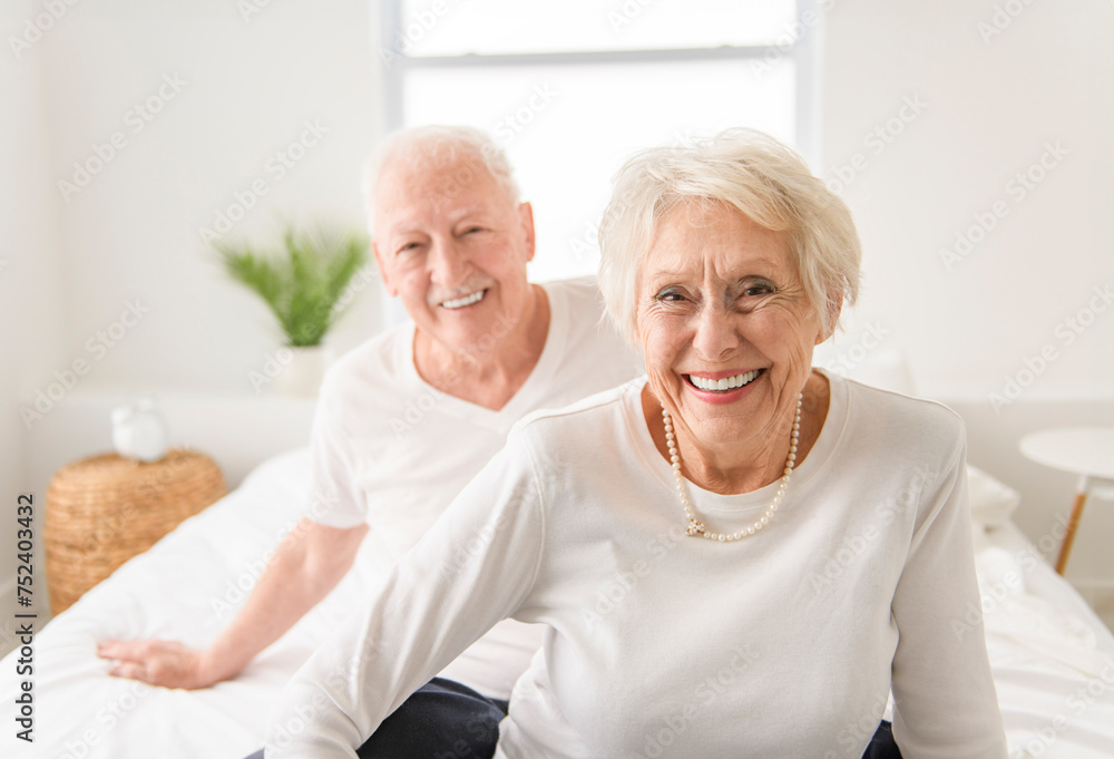 Senior 80 years old Couple Relaxing In Bed together Senior 80 years old Couple Relaxing In Bed together