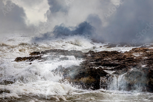 Fototapeta Naklejka Na Ścianę i Meble -  Powerful Ocean Waves Crashing Against Rocky Coastline