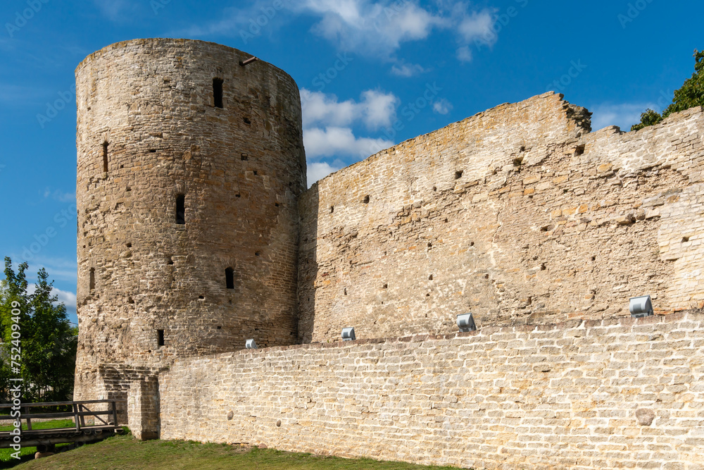 Izborsk, Russia, September 7, 2023. Dilapidated wall and fortress tower.