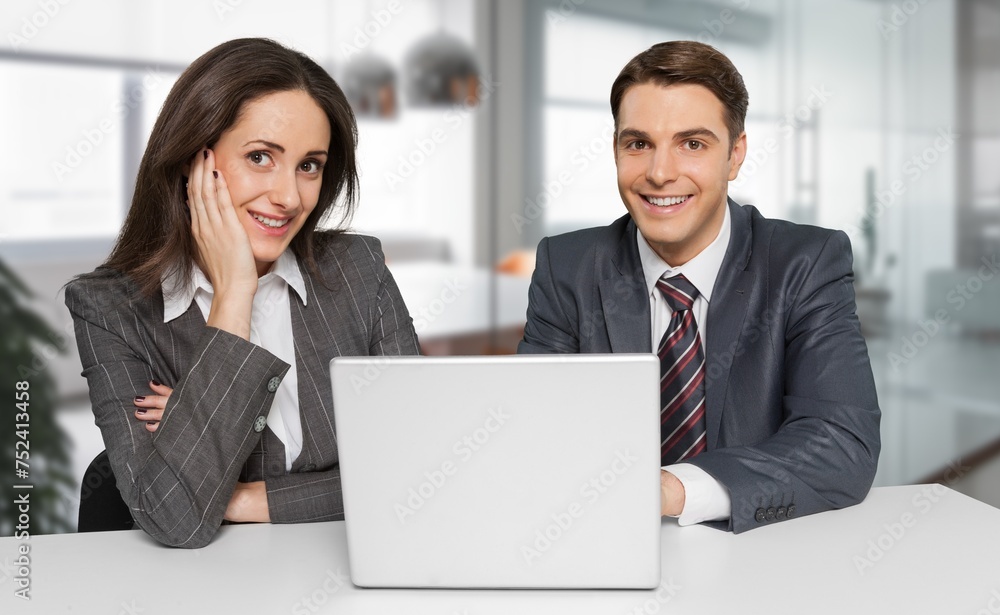 Two colleagues discussing something in office