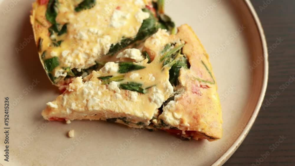 delicious spring frittata with spinach and cherry tomatoes close-up delicious spring frittata with spinach and cherry tomatoes close-up