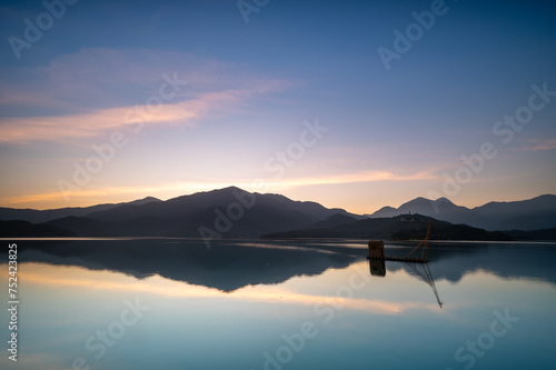 Before sunrise  the view of the dock with lakes and mountains. Sun Moon Lake is one of Taiwan s famous tourist attractions. Nantou county.