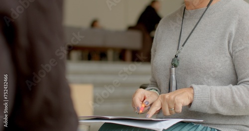 Tableau sur toile Female employee at insurance company conducts consultations for clients, providing detailed information on various insurance policies and options available