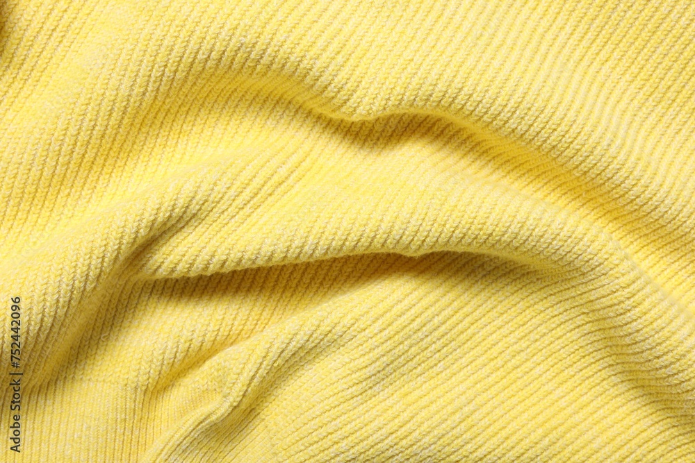Texture of soft yellow fabric as background, top view Texture of soft yellow fabric as background, top view