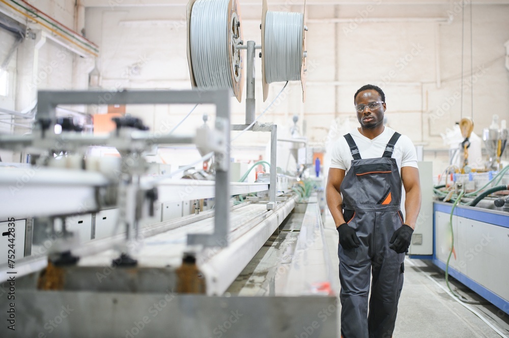 Factory for aluminum and PVC windows and doors production. Manual worker assembling PVC windows and doors Factory for aluminum and PVC windows and doors production. Manual worker assembling PVC windows and doors