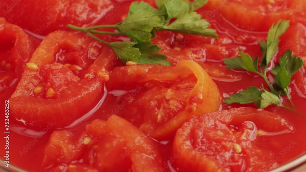 Peeled tomatoes texture, fresh canned tomato Juice sauce, bowl with peeled tomatoes in their own juice, Top view close up, Italian traditional cuisine food. Peeled tomatoes texture, fresh canned tomato Juice sauce, bowl with peeled tomatoes in their own juice, Top view close up, Italian traditional cuisine food.