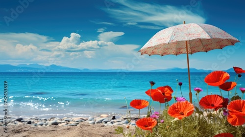 Flowers and umbrella on the beach with blue sky and sea background