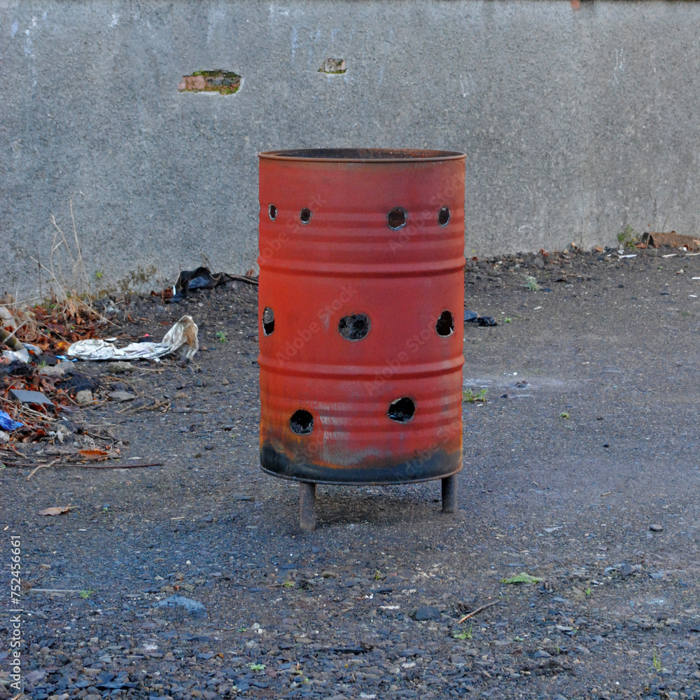Obraz premium Close Up of Old Rusty Oil Drum Used as Outdoor Incinerator 