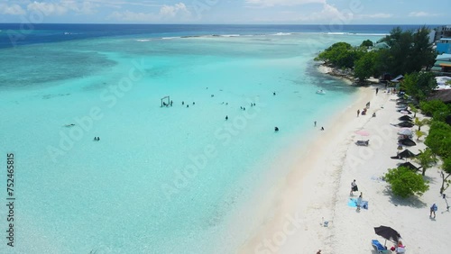 Gulhi island near Maafushi on Kaafu Atoll. Tropical Island with clear ocean and beach at Maldives. Aerial View photo