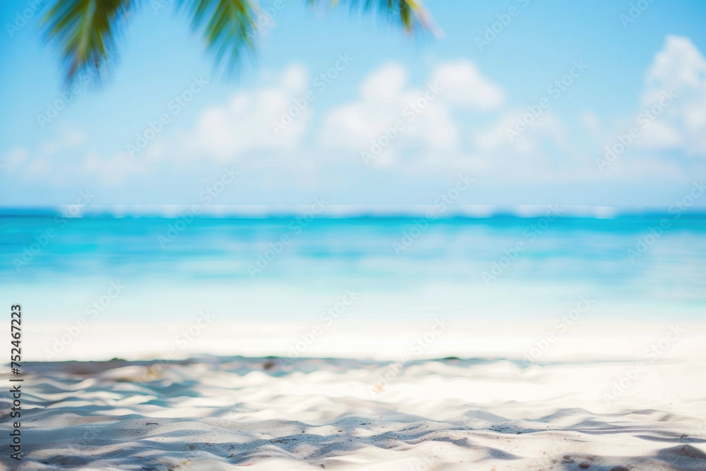 Tropical beach with palm trees, sand, waves and sun light, defocused abstract background with copy space