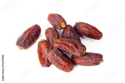 Dried date palm fruits on the white background