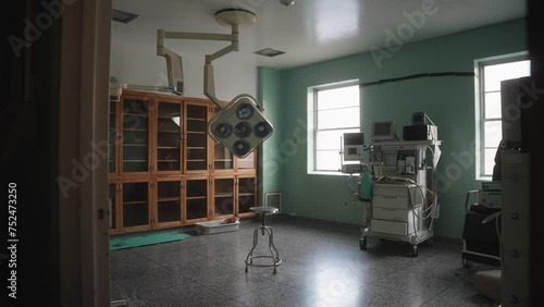 Old Empty Hospital Operating Room with Large Equipment