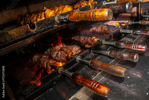 Brazilian style beef ribs Barbecue grill on skewers  at a churrascaria steakhouse in Brazil. photo