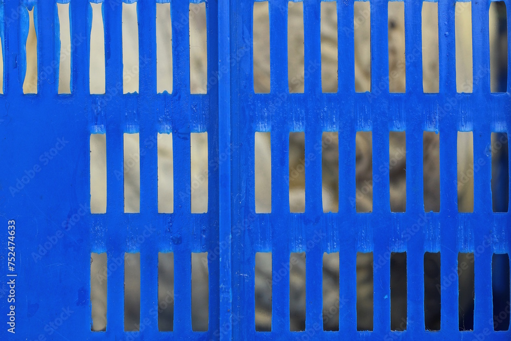 texture of part of a blue plastic lattice on a gray background