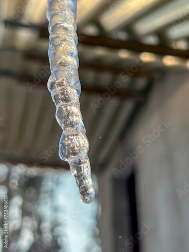 Icicle with water flowing down it  close-up