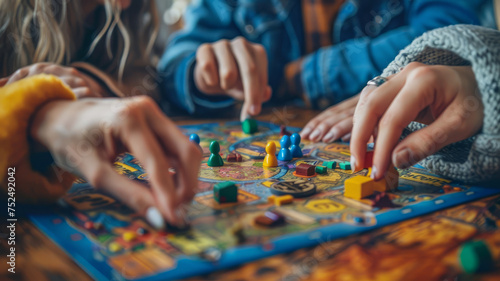 People playing a colorful board game on a table.