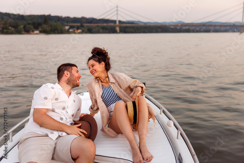 Couple relaxing while sailing on a boat on summer vacation © Impact Photography