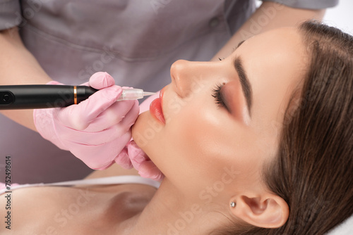 Permanent make-up for eyebrows and lips of beautiful woman in beauty salon. Closeup beautician doing eyebrows tattooing. arrows on the eyes