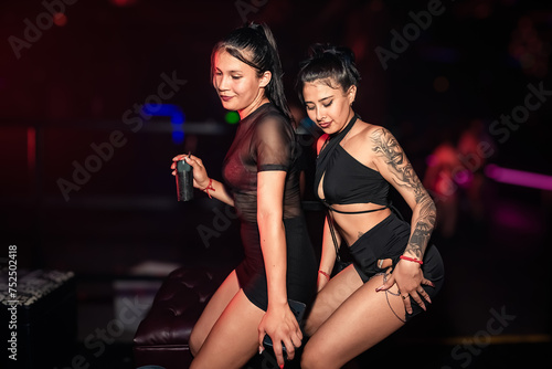 girls dancing to reggaeton rhythm at a party. perreo. twerking