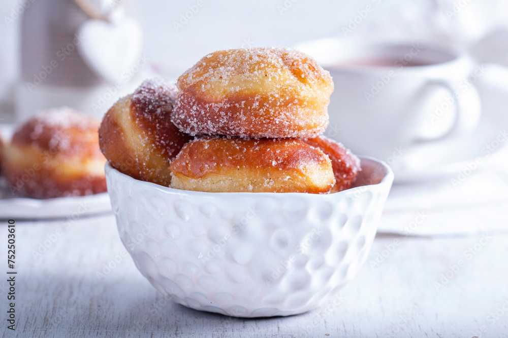 Donuts with sugar and cinnamon served with cocoa. Traditional dessert for Carnival.