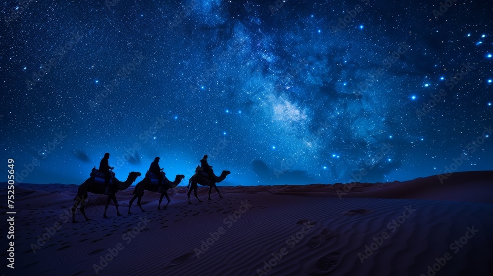 Fototapeta premium A camel caravan slowly traversing the undulating dunes
