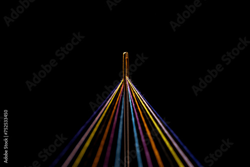 Rainbow Colored Threads Through Needle Eyelet