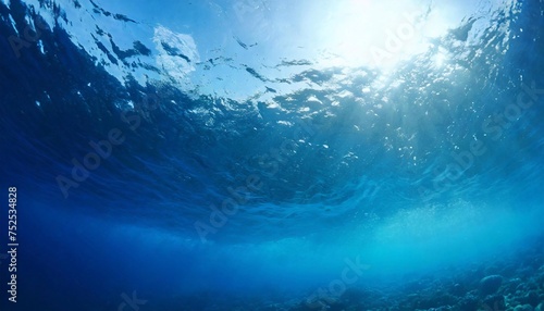 Blue ocean water background at depth, view from the water.