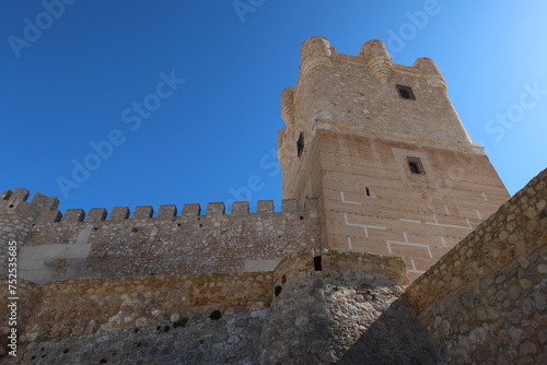 Villena, Alicante, Spain, March 6, 2024: Tower and defensive wall of the medieval castle of Arab origin of the Atalaya. Villena, Alicante, Spain photo