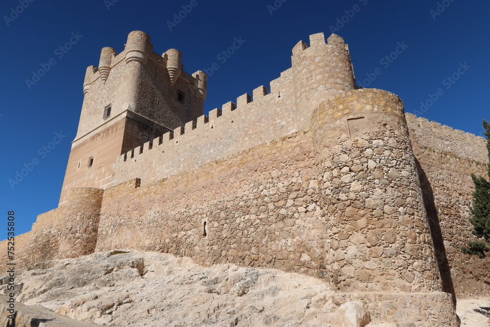 Villena, Alicante, Spain, March 6, 2024: Defensive wall and stone towers of the medieval Atalaya Castle of Arab origin. Villena, Alicante, Spain