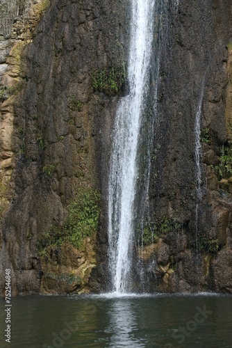 Waterfall cascade on mountain rocks 