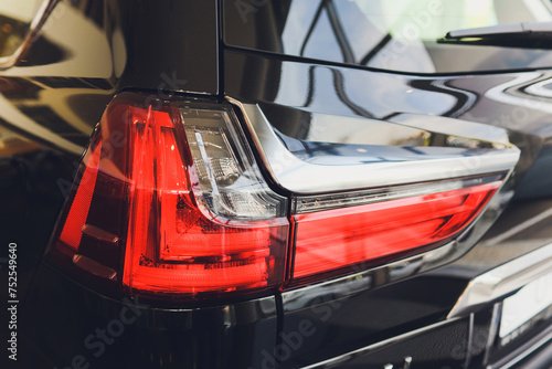 Car detail. New led taillight by night. The rear lights of the car, in hybrid sports car. Developed Car's rear brake light. photo