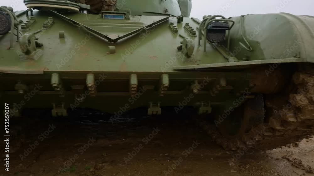 Caterpillar tracks on military tank moving. War in Ukraine. Tank caterpillar. Gunning of civilians. military action. Caterpillar tracks on military tank moving. War in Ukraine. Tank caterpillar. Gunning of civilians. military action.