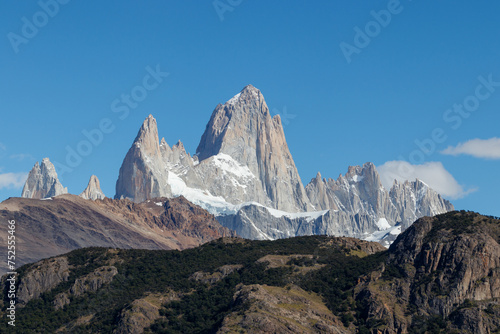 Mount Fitz Roy also known as Cerro Chalten, Cerro Fitz Roy, or Monte Fitz Roy close up on a sunny day with blue sky. It is a mountain in Patagonia, on the border between Argentina and Chile