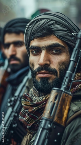 Iranian militiamen with weapons in their hands in an atmosphere of unity and purpose. Close-up of Iranian militiamen with a look of serenity and determination. photo