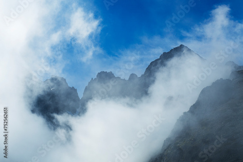beautiful cloudy sky with the foggy mountains on the background