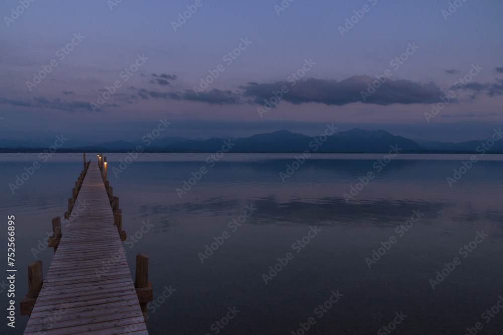 Fototapeta premium Wooden pier leaks into the lake chiemsee