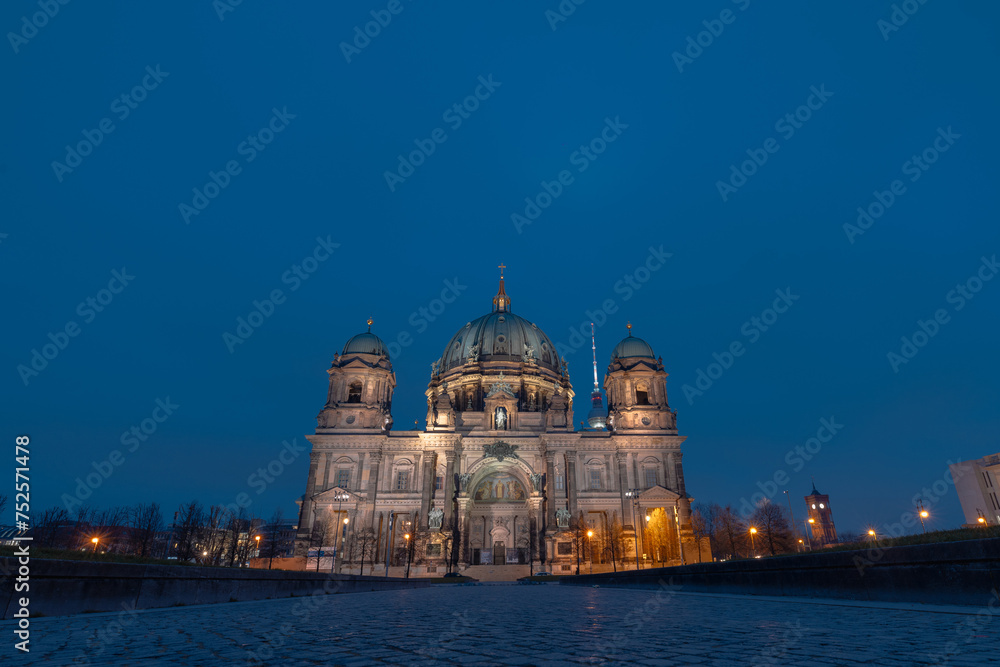 Berliner dom or Berlin cathedral in evening light, blue skies and yellow building. Romantic setting in the cold spring time. Long exposure photo.