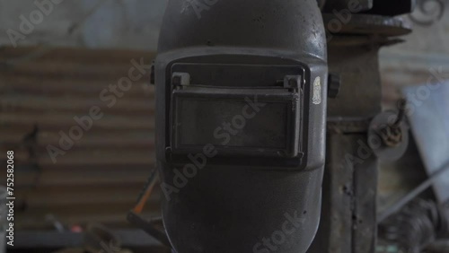 Wallpaper Mural The image shows a welding helmet placed in a blacksmith shop, ready for use. The helmet, an essential protective equipment in welding work, guarantees the safety of the welder. Torontodigital.ca