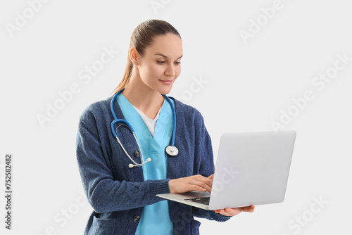 Female medical intern using...