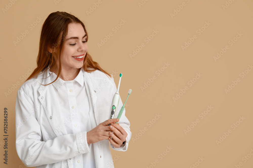 Female dentist with different toothbrushes on beige background. World Dentist Day Female dentist with different toothbrushes on beige background. World Dentist Day