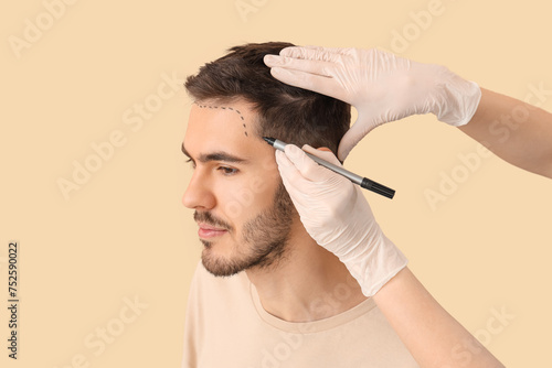Doctor marking young man's ...
