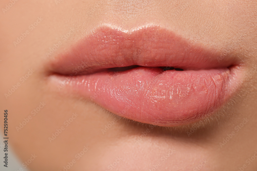 Fototapeta premium Lips of beautiful young woman, closeup