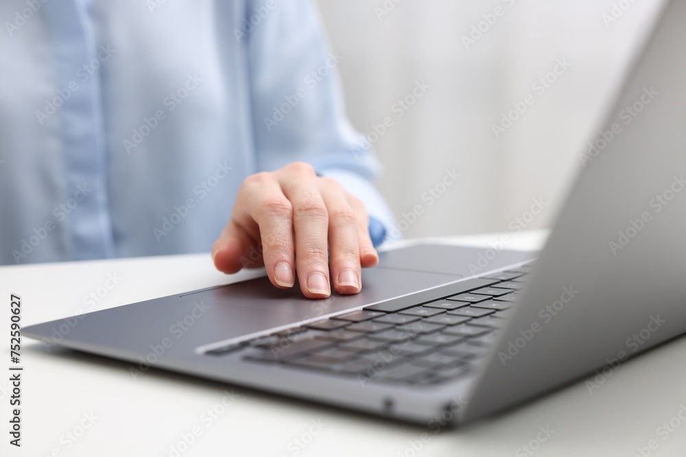 E-learning. Woman using laptop at white table indoors, closeup E-learning. Woman using laptop at white table indoors, closeup