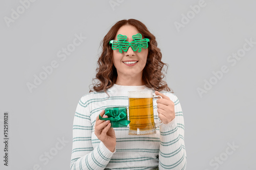 Happy woman with beer and g...