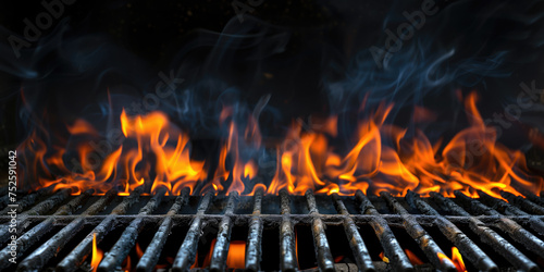 Fierce flames and wisps of smoke rise from a hot grill, ready for a barbecue.