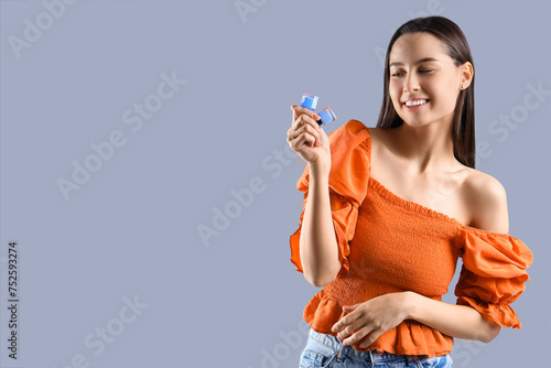 Young woman with nail polis...