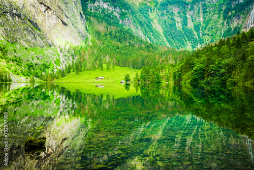 Reflection of the surrounding mountains in lake Obersee near Koenigssee, Berchtesgaden, Bavaria, Germany photo