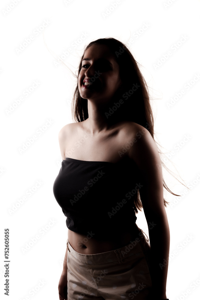 Naklejka premium Half silhouette poirtrait of a beautiful girl with long hair isolated on white background.