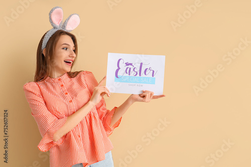 Happy young woman in bunny ...